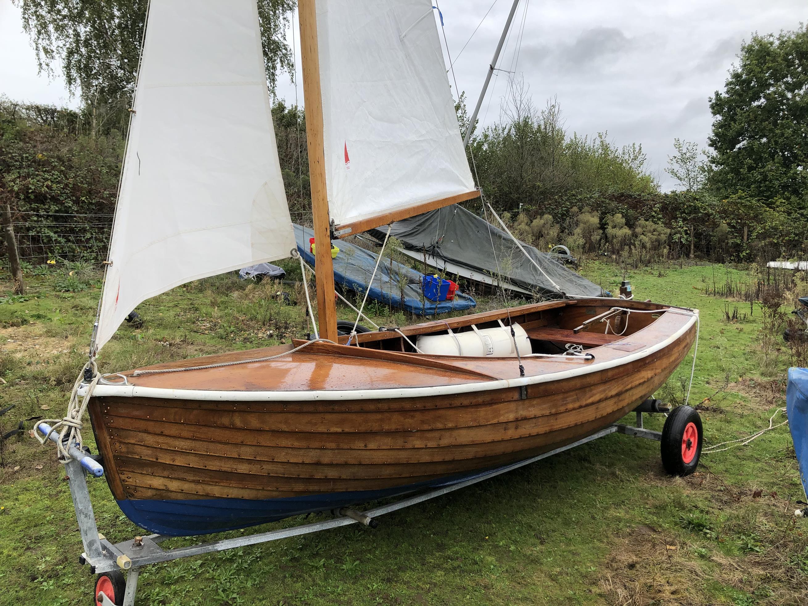 small wooden sailing yacht