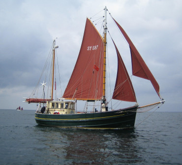 Wooden motor sailer at sea