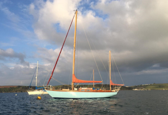Classic wooden sailing yacht on a mooring