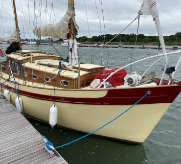 Classic wooden sailing tied to a ponton
