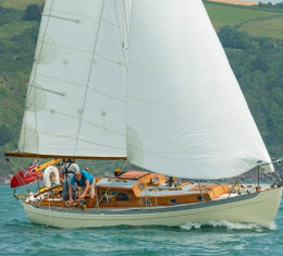 Classic wooden sailing yacht under sail