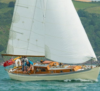 Classic wooden sailing yacht under sail