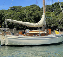 Classic wooden sailing yacht at anchor