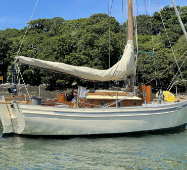 Classic wooden sailing yacht at anchor