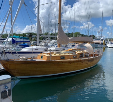 Classic varnished wooden sailing yacht