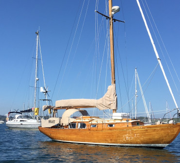 Classic varnished yacht on a mooring