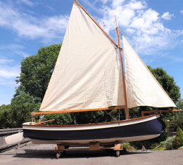 wooden family sailing dinghy